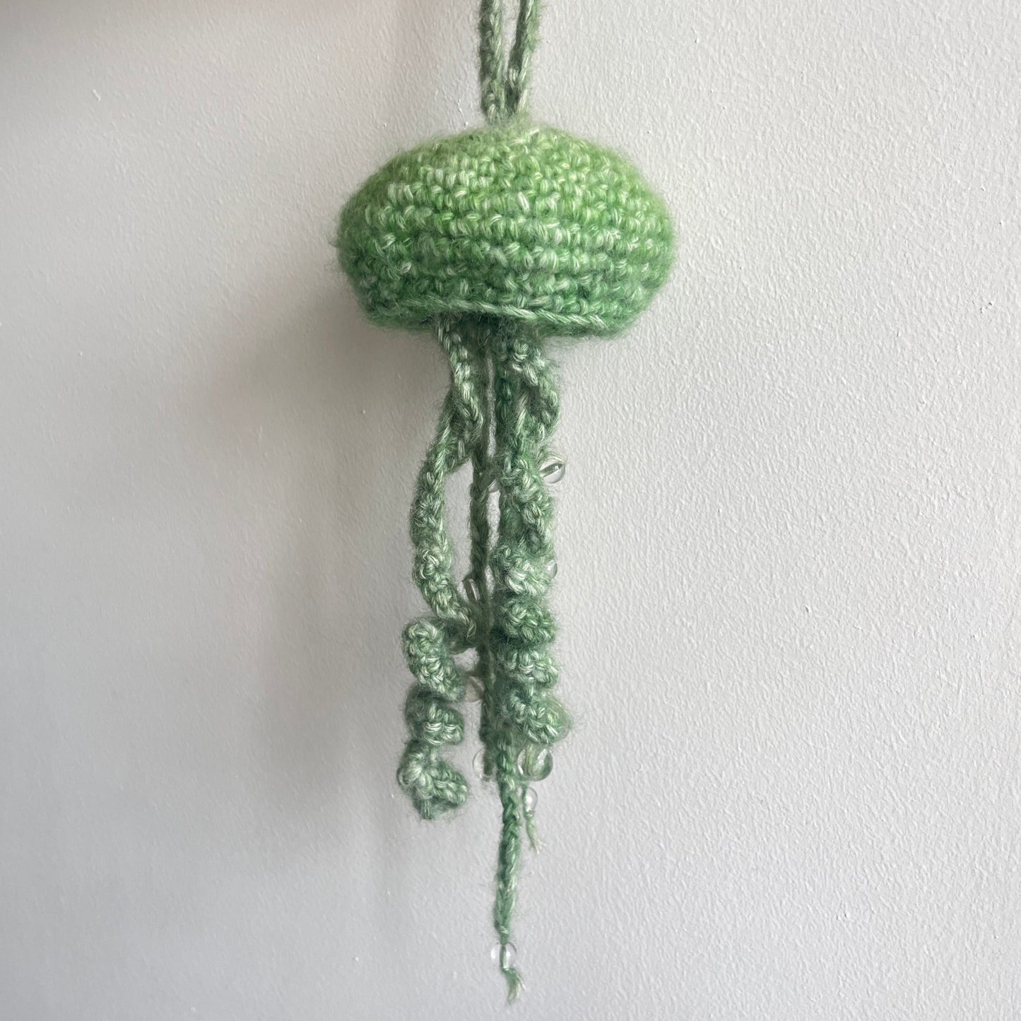 green jellyfish with beads