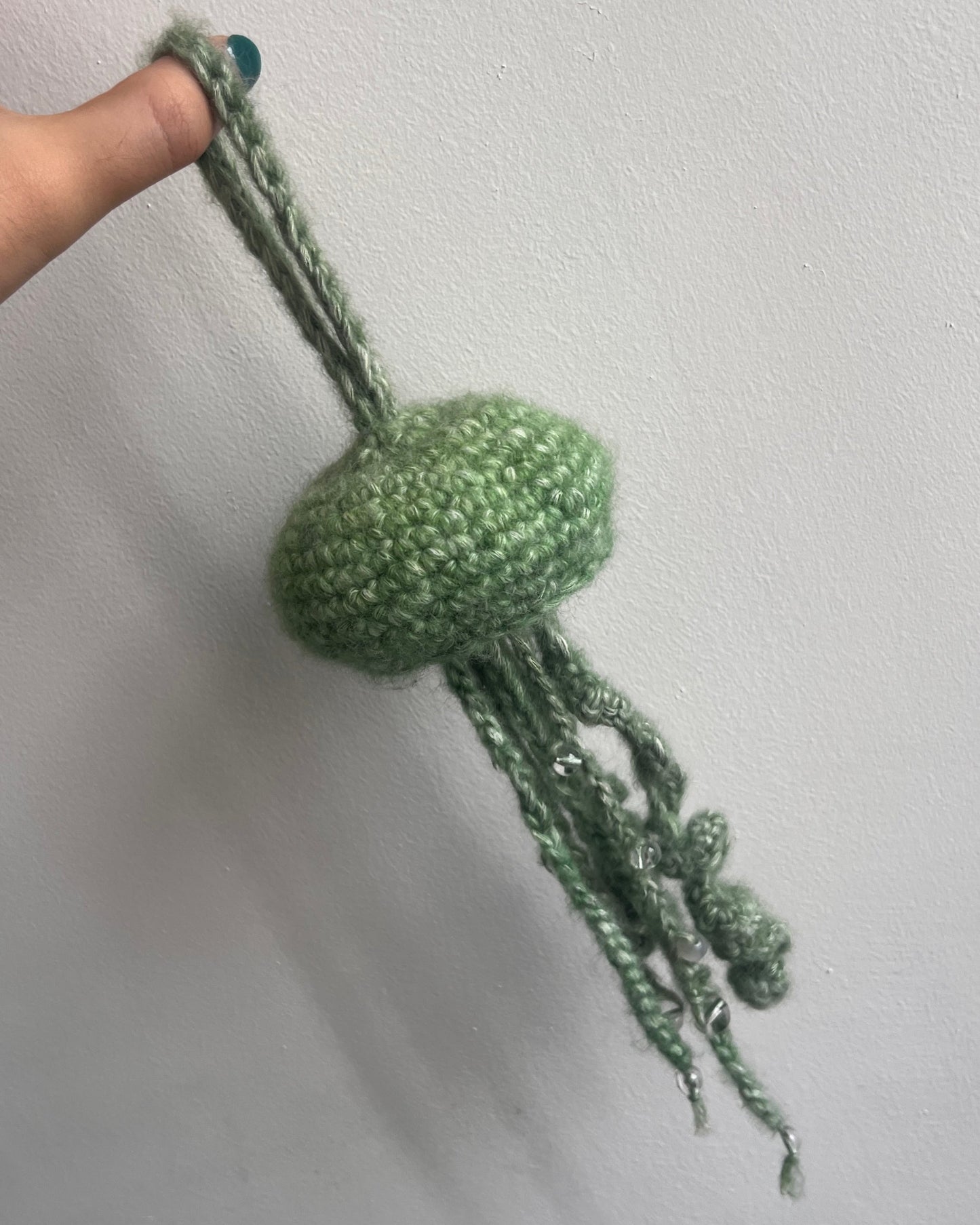 green jellyfish with beads