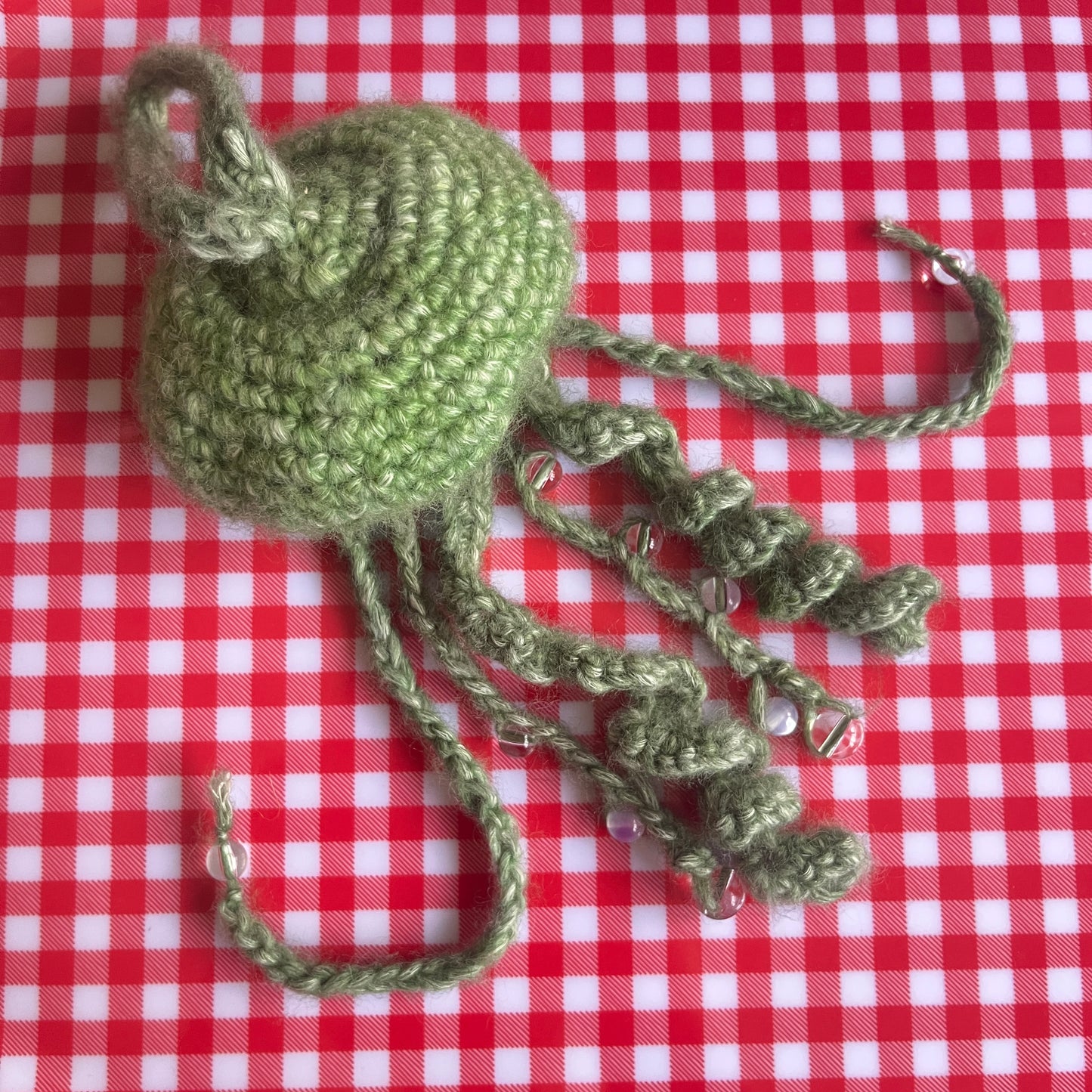green jellyfish with beads