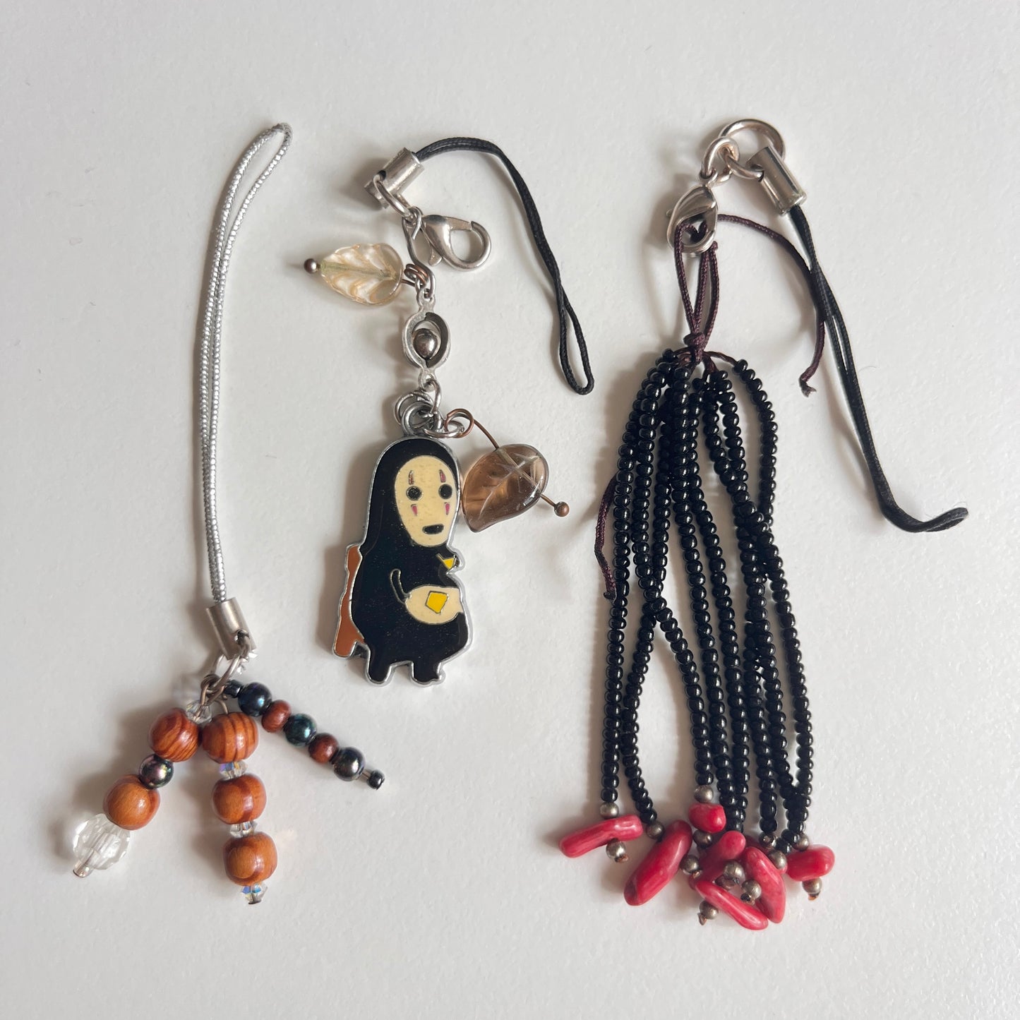 phone strap: assorted trinkets