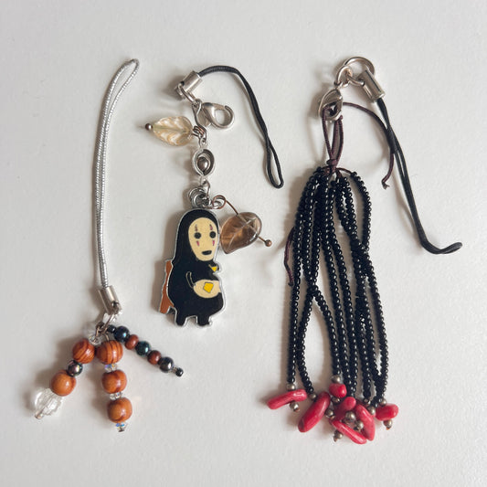 phone strap: assorted trinkets