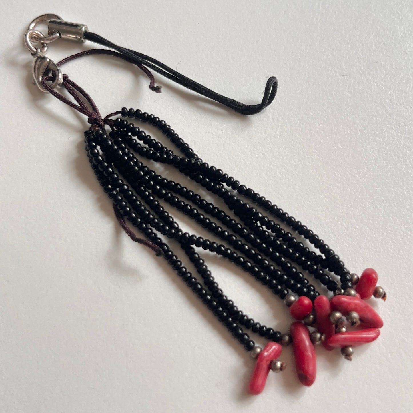 phone strap: assorted trinkets