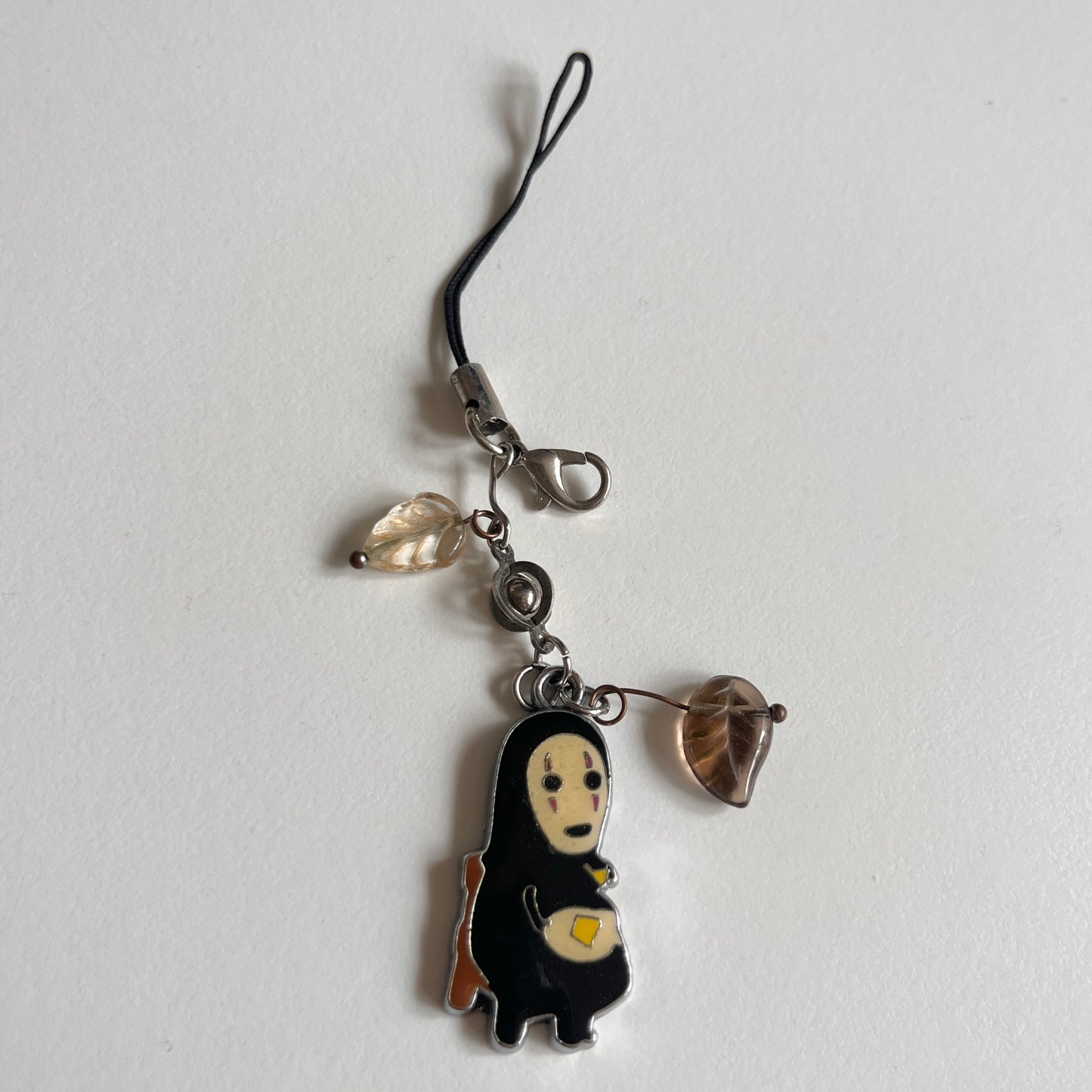 phone strap: assorted trinkets