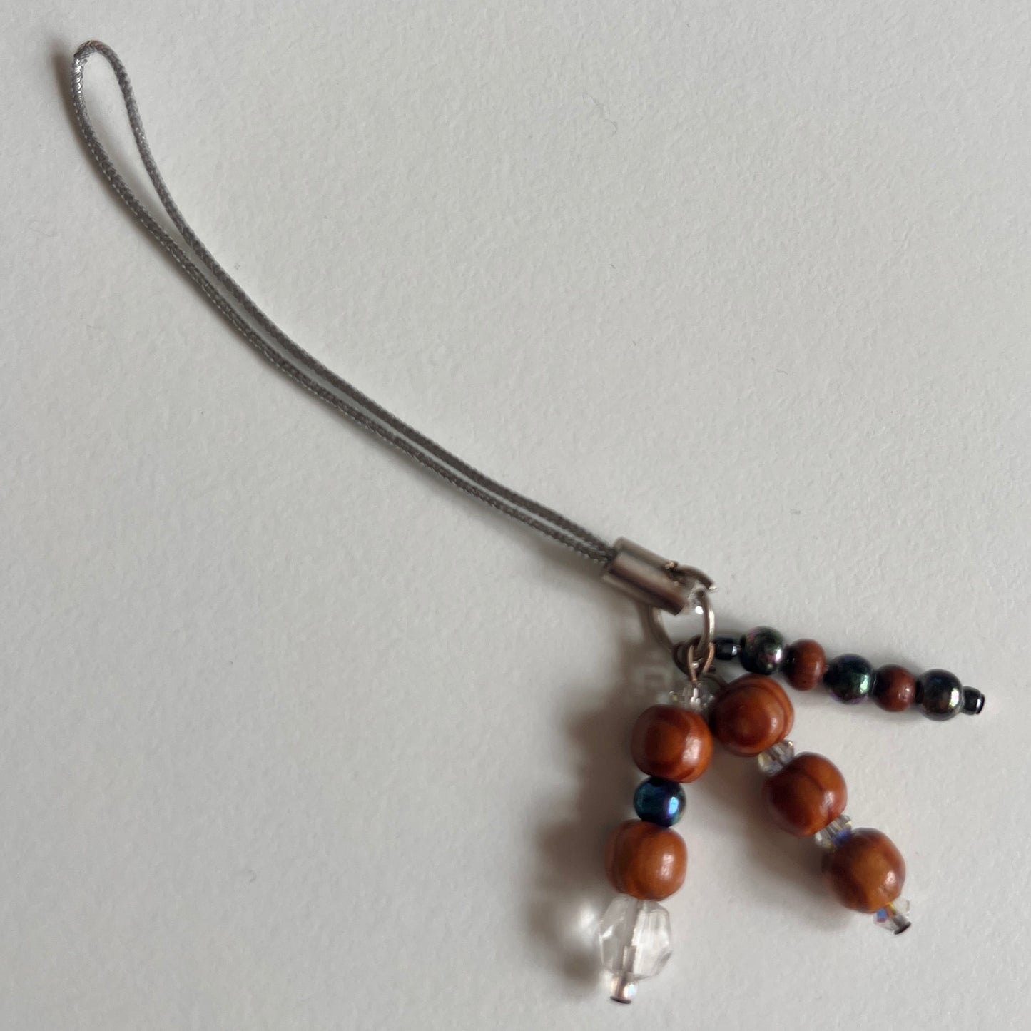 phone strap: assorted trinkets