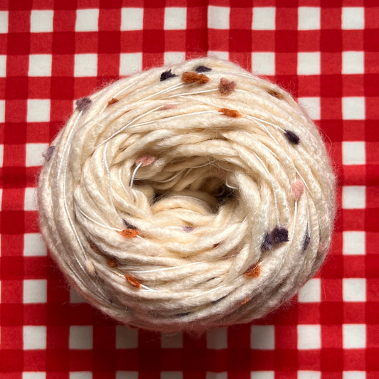 yarn #003: purple/orange pompom [beige]